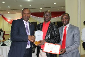 Dr. Rotimi Oladele, President, Nigerian Institute of Public Relations, NIPR (middle) presenting the Corporate Citizen Excellence Award won by SIFAX Group to the General Manager, Corporate Communication, Skyway Aviation Handling Company Limited, SAHCOL (left) and Mr. Olumuyiwa Akande, Corporate Affairs Manager, SIFAX Group, at the NIPR Presidential Dinner and Award ceremony held in Abuja