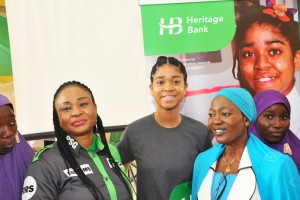 L-R: Mrs. Moji  Niran – Oladunni, Divisional Head, Public Sector, Heritage Bank Limited; : Miss Zuriel Oduwole, Heritage Bank Financial Literacy Ambassador; Mrs. Silifat Nike Jaiyeola, Principal, University of Ilorin Secondary School; and some students of University of Ilorin Secondary School, during the 2016 Financial Literacy Day programme organized by the Bank in Ilorin on Thursday. 
