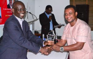 Dr Rotimi Oladele,President Nigerian Institute of Public Relations/Keynote Speaker at Brand Campaign 5th An niversary Lecture and Adwards (left),Presenting the most consistent Brand Journalist award to Mr Goddie Ofose, Leadership Newspaper Reporter/Chairman Brand Journalaist Association of Nigeria (BJAN) ion Lagos- 789marketing