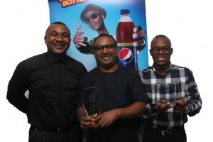 L-R: Account Director, Insight Communications, Jones Bassey, Head Marketing, Seven-Up Bottling Company Plc, Norden Thurston, and Brand Manager, Seven-Up Bottling Company Plc, Segun Ogunleye displaying the OAAN’s Overall Grand PRIX Award won by Pepsi Long throat campaign - 789marketing